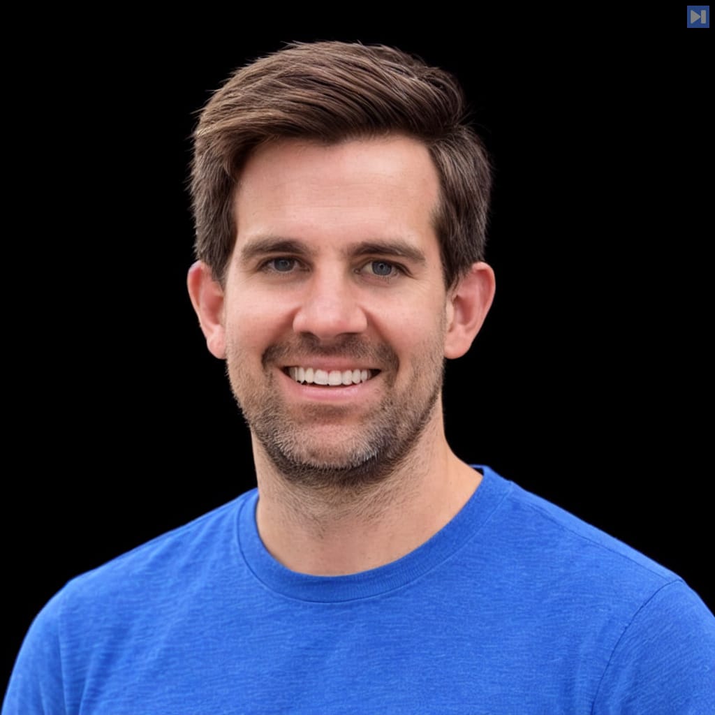 Head-and-shoulders portrait of Zack Korman against a black background.