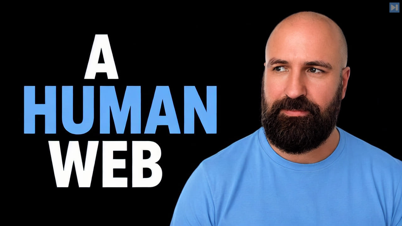 A bald, bearded man in a blue T-shirt beside A HUMAN WEB in white and blue on black.