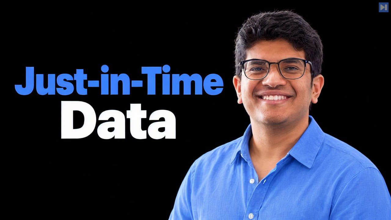 Hrishi Olickel in a blue shirt and glasses against black beside the blue-and-white headline “Just-in-Time Data”.